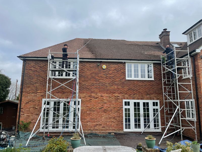 Roof cleaning carried out safely from scaffold towers by The Roof Moss Cleaners in Horndean
